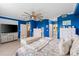 Blue walls and a coastal theme highlight this comfortable bedroom at 6065 Worsham Ln # 104, Bradenton, FL 34211
