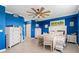 Spacious bedroom with blue walls, ceiling fan and plenty of light at 6065 Worsham Ln # 104, Bradenton, FL 34211