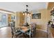 Casual dining area with a rustic table and coastal-themed decor at 6065 Worsham Ln # 104, Bradenton, FL 34211