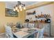 Dining room featuring a rustic table, built-in bar, and coastal decor at 6065 Worsham Ln # 104, Bradenton, FL 34211