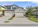 Two-story home with two-car garage and a well-maintained front yard at 6065 Worsham Ln # 104, Bradenton, FL 34211