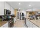 Modern kitchen featuring stainless steel appliances and granite countertops at 6065 Worsham Ln # 104, Bradenton, FL 34211