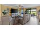 Relaxing living room with reclining sofas and view of the golf course at 6065 Worsham Ln # 104, Bradenton, FL 34211