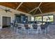 Community pool bar with seating and large TV at 6065 Worsham Ln # 104, Bradenton, FL 34211