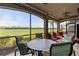Enjoy outdoor dining and golf course views from this screened porch at 6065 Worsham Ln # 104, Bradenton, FL 34211