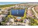 Aerial view of community with lake, pool, and clubhouse at 6247 Champions Row St, Bradenton, FL 34210