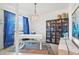 Bright home office with built-in shelving and a large desk at 6247 Champions Row St, Bradenton, FL 34210