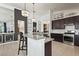 Modern kitchen with stainless steel appliances and an island at 6247 Champions Row St, Bradenton, FL 34210