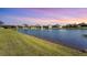 Stunning lakefront property with peaceful water views and lush landscaping at 6247 Champions Row St, Bradenton, FL 34210