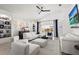 Spacious living room with white sofas and large windows at 6247 Champions Row St, Bradenton, FL 34210
