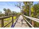 Wooden walkway through lush greenery at 6247 Champions Row St, Bradenton, FL 34210