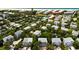 Aerial image showing houses near the beach and tennis courts at 6250 Holmes Blvd # 71, Holmes Beach, FL 34217