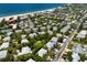 Aerial view of a coastal neighborhood with houses near the beach at 6250 Holmes Blvd # 71, Holmes Beach, FL 34217