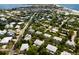 Aerial view of a coastal neighborhood with beach nearby at 6250 Holmes Blvd # 71, Holmes Beach, FL 34217