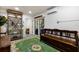 Finished basement with built-in shelving and access to the backyard at 6250 Holmes Blvd # 71, Holmes Beach, FL 34217