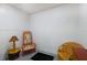Small basement room with two chairs and a lamp at 6250 Holmes Blvd # 71, Holmes Beach, FL 34217