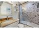 Updated bathroom with granite countertop and hexagon tile shower at 6250 Holmes Blvd # 71, Holmes Beach, FL 34217