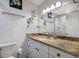 Bathroom with granite countertop and double vanity at 6250 Holmes Blvd # 71, Holmes Beach, FL 34217