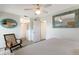 Bedroom with ceiling fan, large mirror, and brick-style flooring at 6250 Holmes Blvd # 71, Holmes Beach, FL 34217