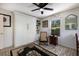 Guest bedroom with a comfortable chair and a full-sized wall bed at 6250 Holmes Blvd # 71, Holmes Beach, FL 34217