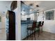 Modern kitchen with blue countertops, stainless steel appliances, and a breakfast bar at 6250 Holmes Blvd # 71, Holmes Beach, FL 34217