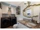 Laundry room with washer, dryer, and granite countertop at 6250 Holmes Blvd # 71, Holmes Beach, FL 34217