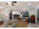 Open living area with a view into the kitchen and staircase leading upstairs at 6250 Holmes Blvd # 71, Holmes Beach, FL 34217