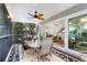 Spacious screened porch with access to the living room and lush views at 6250 Holmes Blvd # 71, Holmes Beach, FL 34217