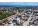 Aerial view showcases a coastal home with a private pool, nestled in a charming neighborhood at 6473 Gulf Of Mexico Dr, Longboat Key, FL 34228