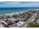 Coastal community aerial view with beach access, showcasing multiple homes near the ocean at 6473 Gulf Of Mexico Dr, Longboat Key, FL 34228