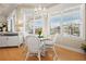 Bright dining area with white furnishings, hardwood floors and lots of natural light at 6473 Gulf Of Mexico Dr, Longboat Key, FL 34228