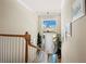High ceiling entryway with a beautiful chandelier, lots of light, and a wooden staircase at 6473 Gulf Of Mexico Dr, Longboat Key, FL 34228