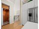 Hallway with an elevator and staircase that leads to the second floor and modern appliances at 6473 Gulf Of Mexico Dr, Longboat Key, FL 34228