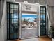 Enjoy outdoor living with partial ocean views from this covered lanai with seating at 6473 Gulf Of Mexico Dr, Longboat Key, FL 34228