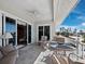 Relax and enjoy the outdoors on this covered lanai, equipped with seating and partial ocean views at 6473 Gulf Of Mexico Dr, Longboat Key, FL 34228