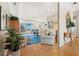 Inviting living room features stylish decor, an open floor plan, and water views beyond the lanai at 6473 Gulf Of Mexico Dr, Longboat Key, FL 34228