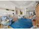 Open living room showcases a stylish blue rug, bright decor, and an open floorplan at 6473 Gulf Of Mexico Dr, Longboat Key, FL 34228
