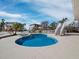 Beautiful backyard featuring a uniquely shaped pool, lounge chairs, and tropical landscaping at 6473 Gulf Of Mexico Dr, Longboat Key, FL 34228