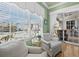 Cozy sitting area features a beautiful beach view, comfortable seating, and plenty of natural light at 6473 Gulf Of Mexico Dr, Longboat Key, FL 34228