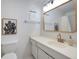 Clean bathroom with a vanity, mirror, and shower/tub combo at 6884 W Country Club Ln, Sarasota, FL 34243