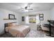 Bright bedroom featuring a queen bed and home office at 6884 W Country Club Ln, Sarasota, FL 34243