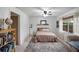 Cozy bedroom with a queen bed and access to exterior at 6884 W Country Club Ln, Sarasota, FL 34243