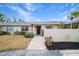 Front view of a condo with a walkway and landscaping at 6884 W Country Club Ln, Sarasota, FL 34243