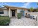 Inviting front entry with a private patio area at 6884 W Country Club Ln, Sarasota, FL 34243