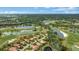 Aerial view showing the community's location near a golf course and lakes at 7019 Vilamoura Pl, Lakewood Ranch, FL 34202
