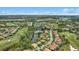 Expansive aerial view of a golf course community with houses and lakes at 7019 Vilamoura Pl, Lakewood Ranch, FL 34202