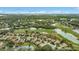 Aerial view of a residential neighborhood near a golf course and lakes at 7019 Vilamoura Pl, Lakewood Ranch, FL 34202