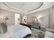 Main bedroom with a king-size bed and access to the bathroom at 7019 Vilamoura Pl, Lakewood Ranch, FL 34202