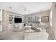 Comfortable Gathering room with built-in shelving and a large TV at 7019 Vilamoura Pl, Lakewood Ranch, FL 34202