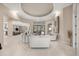 Spacious living room with high ceilings, neutral color palette, and access to the backyard at 7019 Vilamoura Pl, Lakewood Ranch, FL 34202